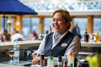 Fred. Olsen Cruise Lines Kiefer serving drinks at Bolette's Lido Bar.jpg